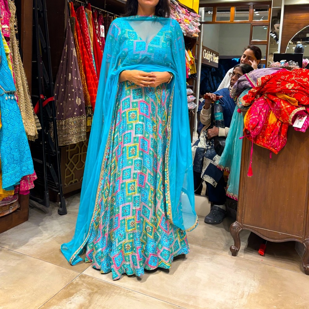 Beautiful turquoise and pink and yellow lengha. Never worn. Comes with dupatta